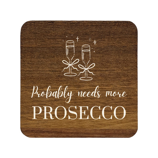 Square wooden coaster with champagne glasses and text 'Probably needs more Prosecco' on a white background