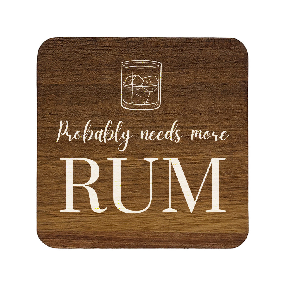 Square wooden coaster with a glass of rum and ice, and text 'Probably needs more rum' on a white background.