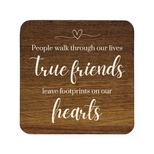 Square wooden coaster with quote 'People walk through our lives, true friends leave footprints on our hearts' in white text.