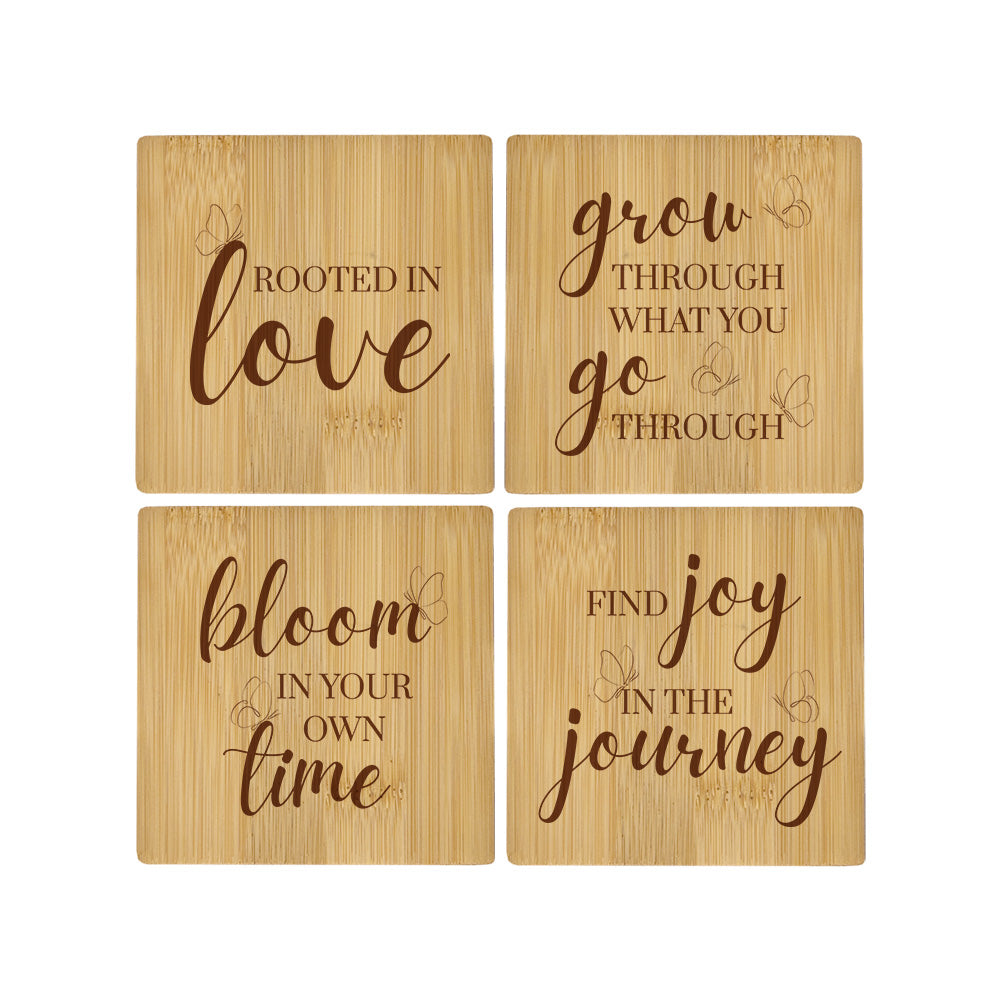 A set of 4 bamboo wood coasters decorated with inspirational quotes about growth and transformation, and decorated with a butterfly motif.