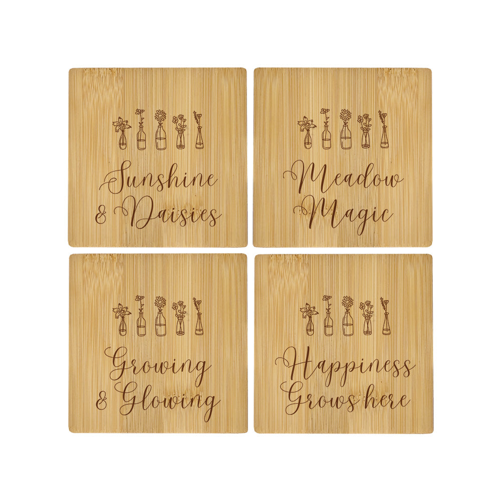 A set of 4 bamboo wood coasters decorated with inspirational quotes.