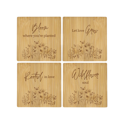 A set of 4 bamboo wood coasters decorated with inspirational quotes and wildflower illustrations.