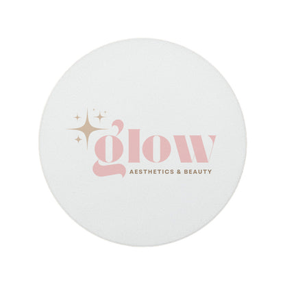 A round ceramic coaster personalised with a beauty salon and aesthetics clinic logo. Your logo here.