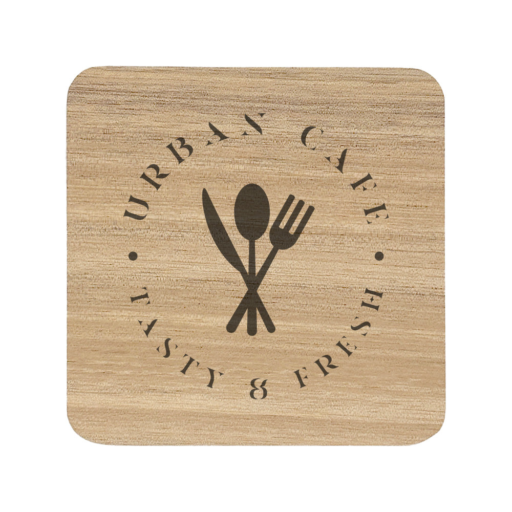 A square wooden coaster with rounded corners, personalised with a dark brown café logo. Your logo here.