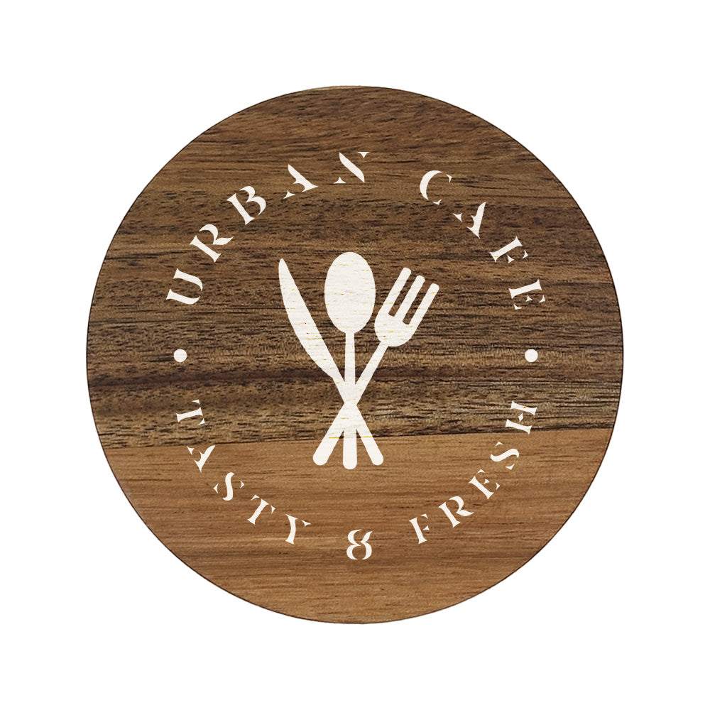 A round wooden coaster personalised with a café business logo in white. Your logo here.