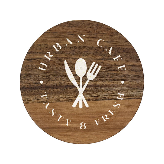 A round wooden coaster personalised with a café business logo in white. Your logo here.