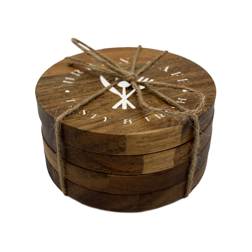 A set of 4 round wooden coasters personalised with a café business logo in white. Your logo here.