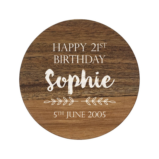 Personalised round wooden coaster with 'Happy 21st Birthday Sophie' text on a white background