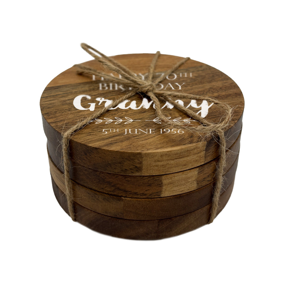 Wooden coaster set with personalised  text on a white background
