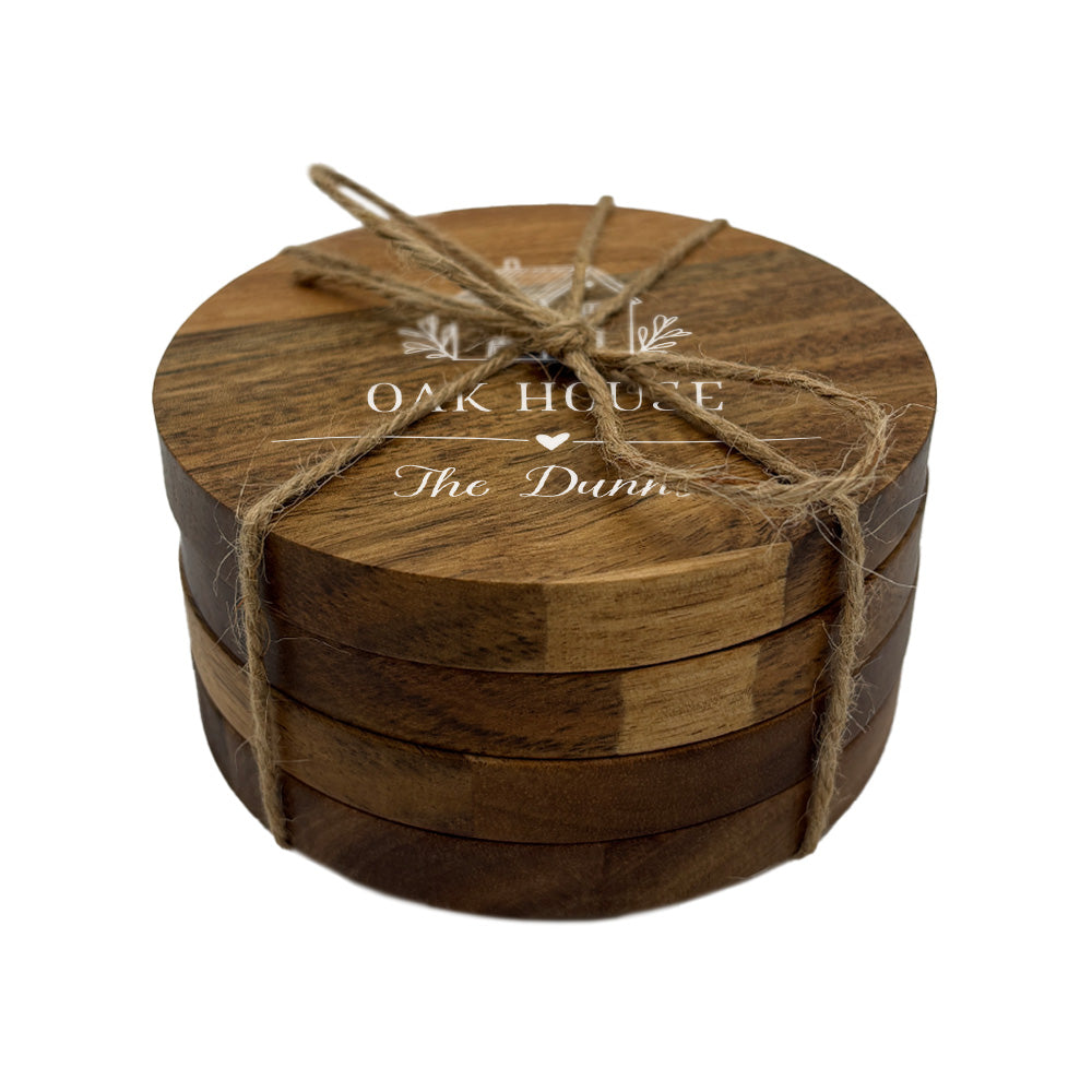 Set of wooden coasters tied with jute string and personalised with a house name and family name.