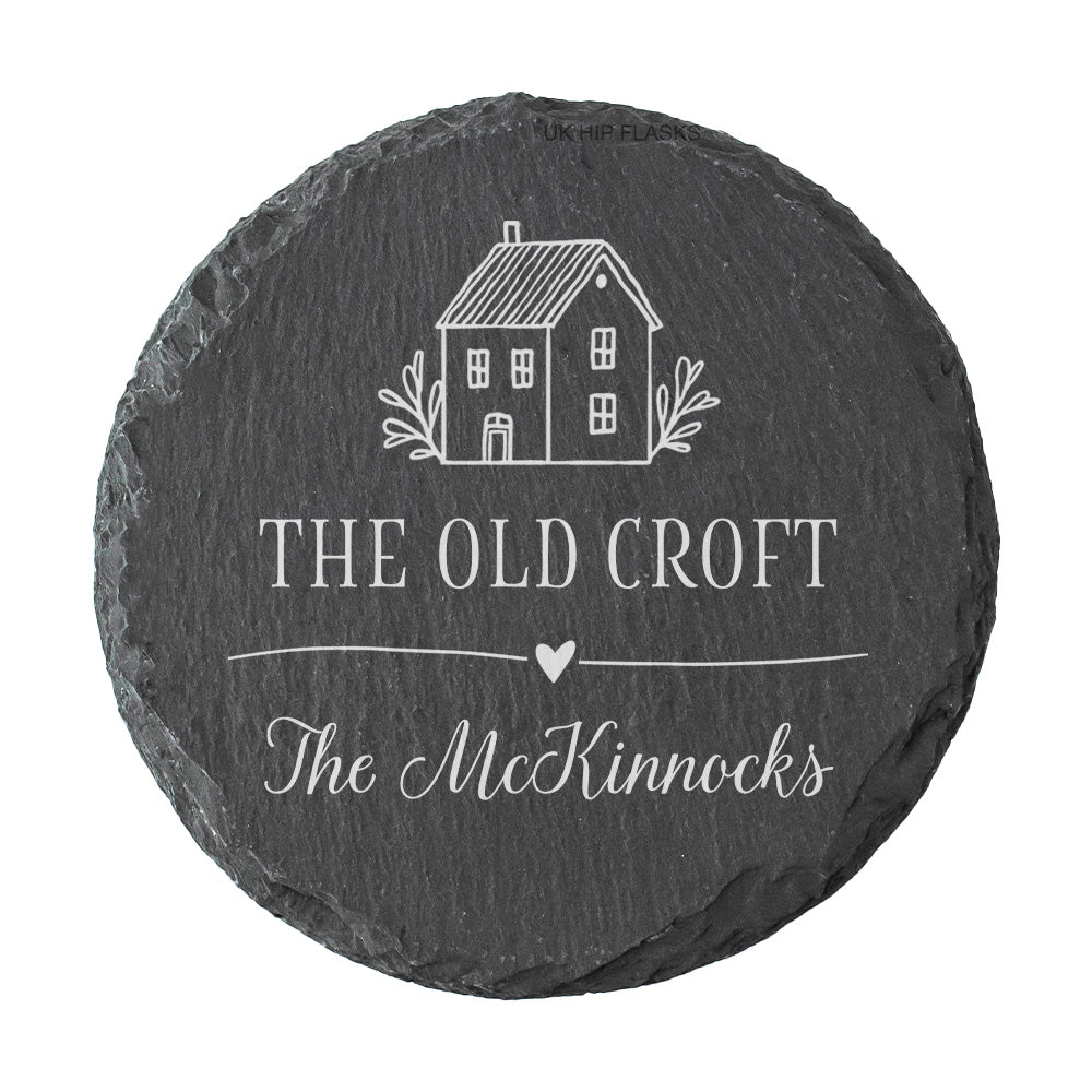Round personalised house name or number slate coaster, personalised with a house name and family name, with a cute house illustration. 