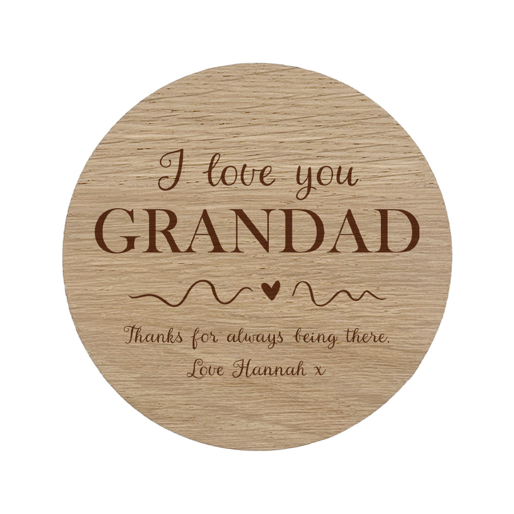 Round wooden coaster with personalised message 'I love you GRANDAD' on a white background