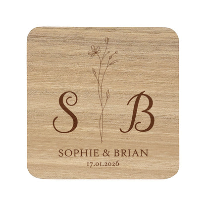 Square acacia wood coaster with personalised initials, names and date, and a floral motif.