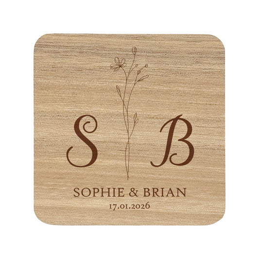 Square acacia wood coaster with personalised initials, names and date, and a floral motif.