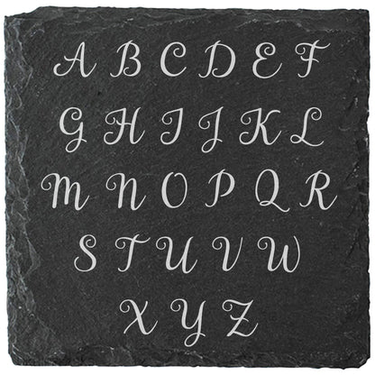 Square slate coaster showing the alphabet letter options for personalisation.