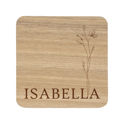Square wooden coaster with personalised name and floral design on a white background