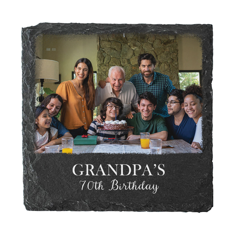A square dark slate photo coaster, featuring a printed family portrait and the engraved text 'GRANDPA'S 70th Birthday' on a white background.