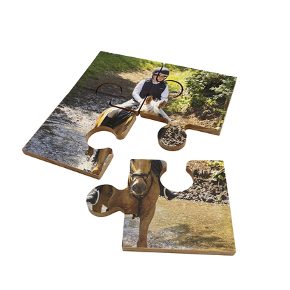 A set of 4 bamboo coasters printed with a photo. The coasters fit together as a jigsaw puzzle to complete the image.