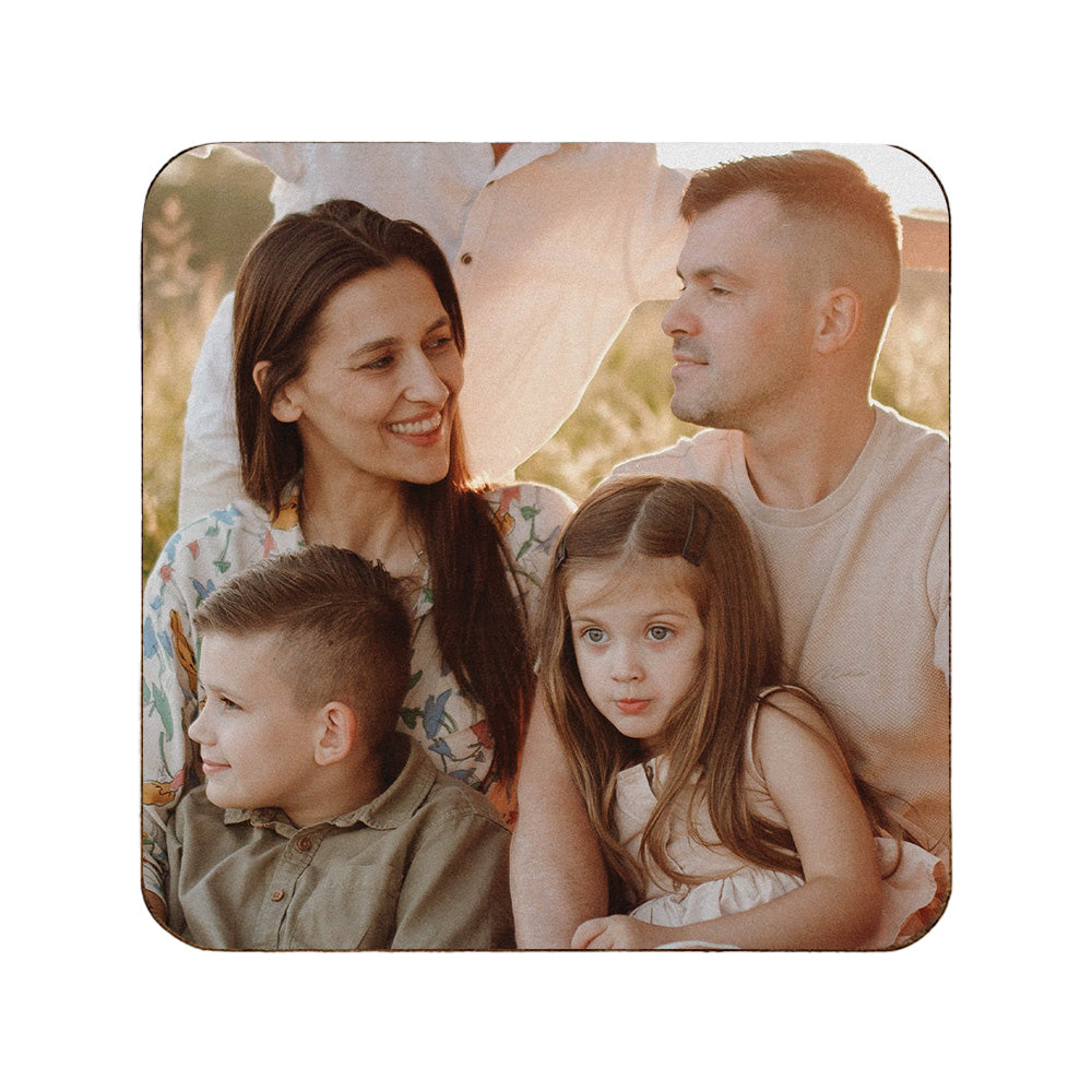 A square wooden coaster personalised with a photo of a family.