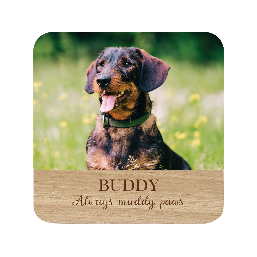 Square personalised wooden coaster with a dog photo and 'Buddy Always muddy paws' text.