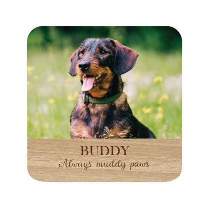 Square personalised wooden coaster with a dog photo and 'Buddy Always muddy paws' text.