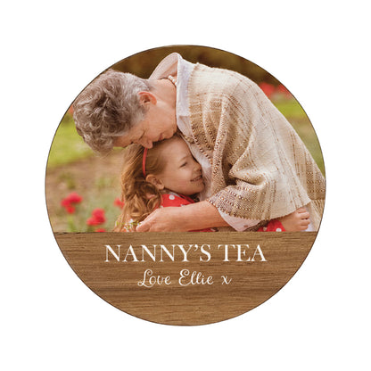 Round wooden coaster personalised with a family photo and custom text.