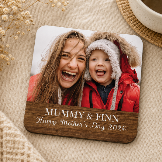 Personalised photo square wooden coaster with a mother and child, and custom text reading 'Happy Mother's Day' on a bedside table.