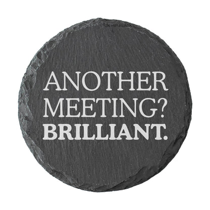 Round slate coaster with humorous text 'Another meeting? Brilliant.' on a white background