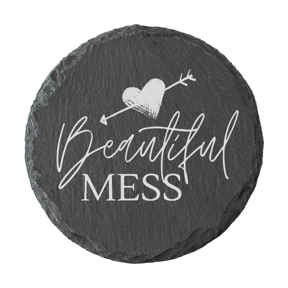 Round slate coaster with 'Beautiful Mess' text and heart design on a white background