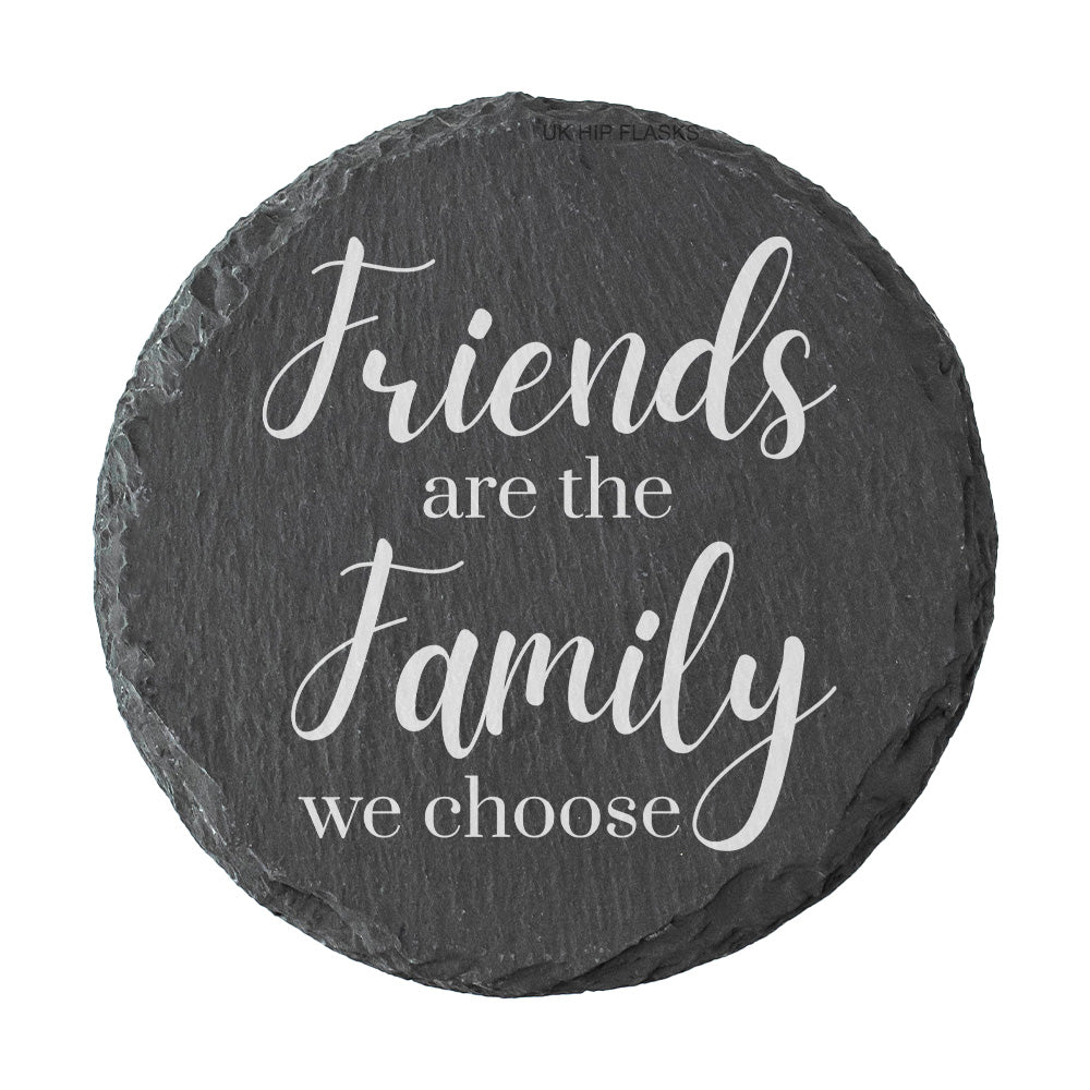 Round slate coaster with the text 'Friends are the family we choose' on a white background