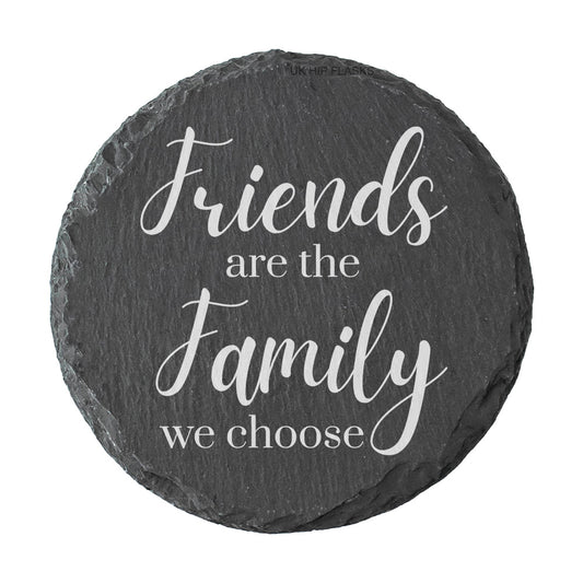 Round slate coaster with the text 'Friends are the family we choose' on a white background