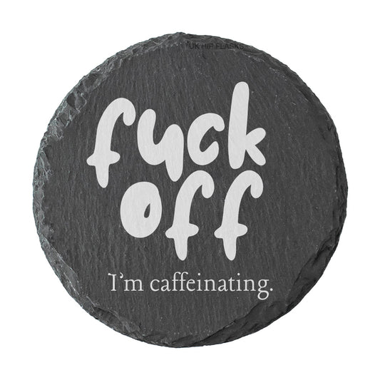 Round slate coaster with the text "Fuck off I'm caffeinating" on a white background