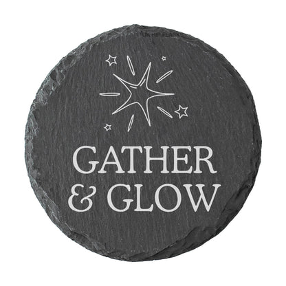 Round slate coaster with 'Gather & Glow' text and star design on a white background