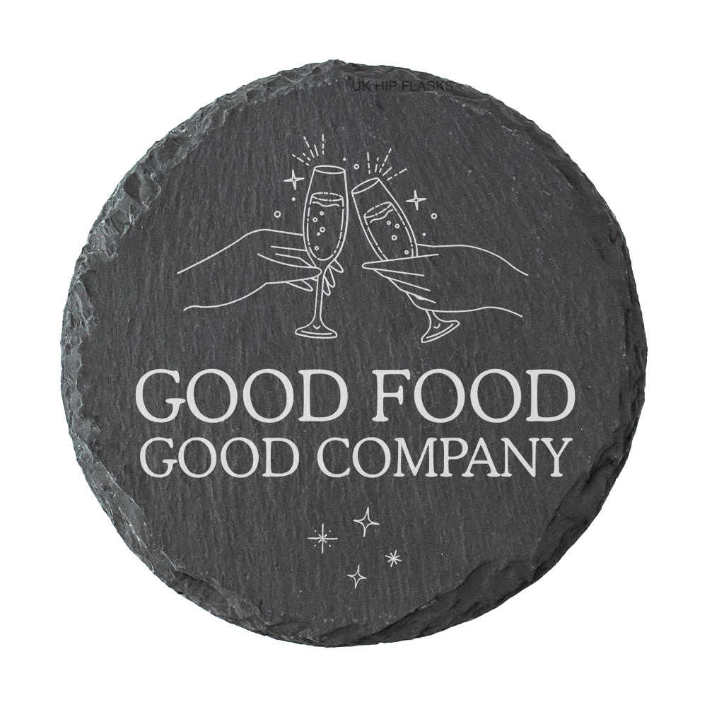A round slate coaster with the quote "Good food good company" in white text.