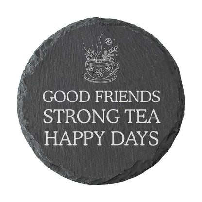 Round slate coaster with tea cup design and text 'Good friends strong tea happy days' on a white background