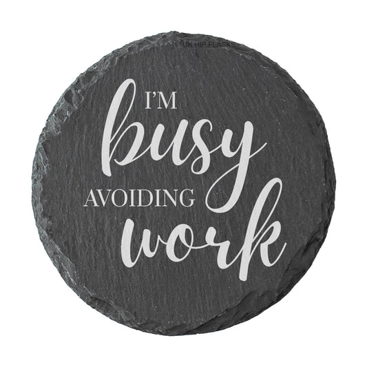 Round slate coaster with 'I'm busy avoiding work' text on a white background