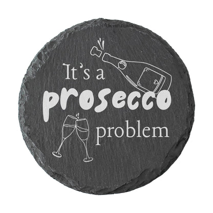 Round slate coaster with 'It's a prosecco problem' text and graphics on a white background