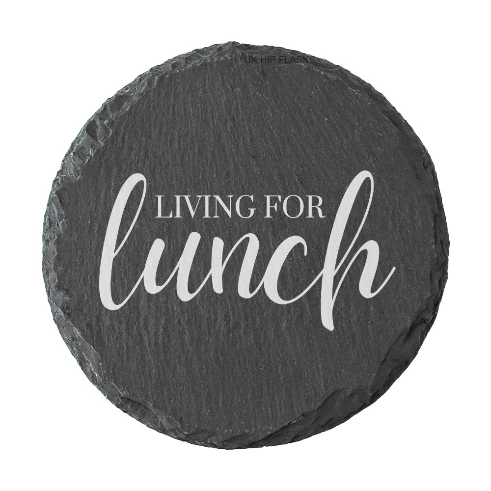 Round slate coaster with 'Living for lunch' text on a white background