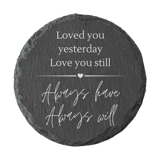 Round slate coaster with quote "loved you yesterday love you still always have always will" in white text.
