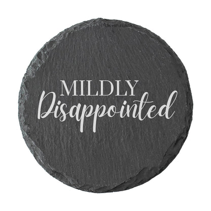 Round slate coaster with 'Mildly Disappointed' text on a white background