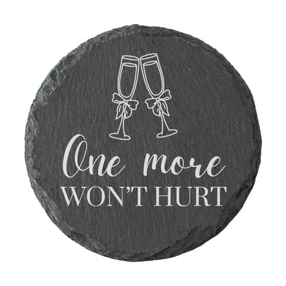 Round slate coaster with champagne glass design and text 'One more won't hurt' on a white background