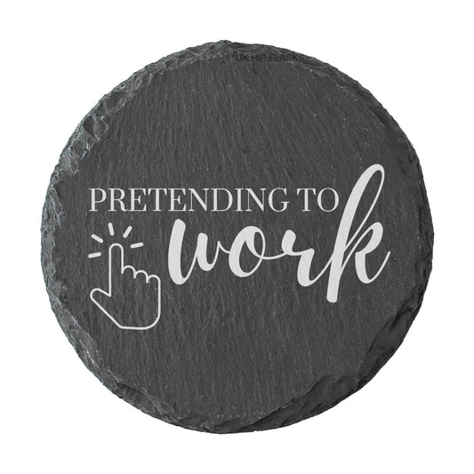 Round slate coaster with 'Pretending to work' text and cursor icon on a white background