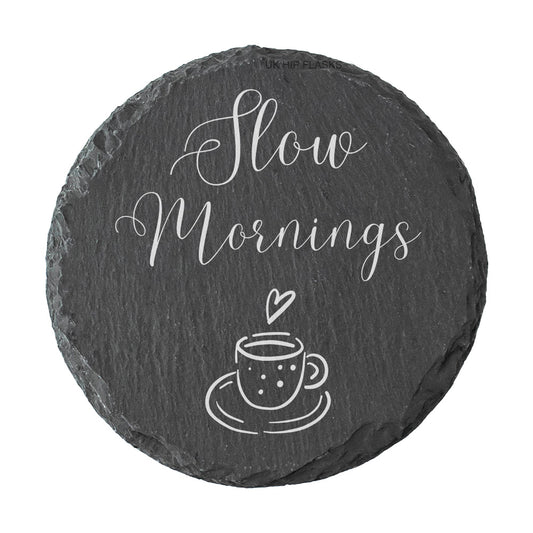 Round slate coaster with 'Slow Mornings' text and a cup illustration on a white background