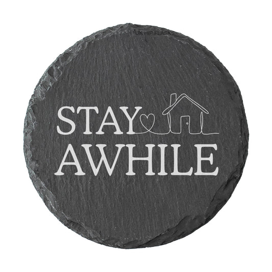 Round slate coaster with 'Stay Awhile' text and house icon on a white background