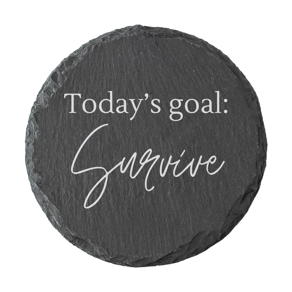 Round slate coaster with 'Today's goal: Survive' text on a white background