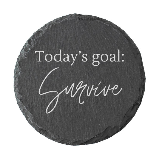 Round slate coaster with 'Today's goal: Survive' text on a white background