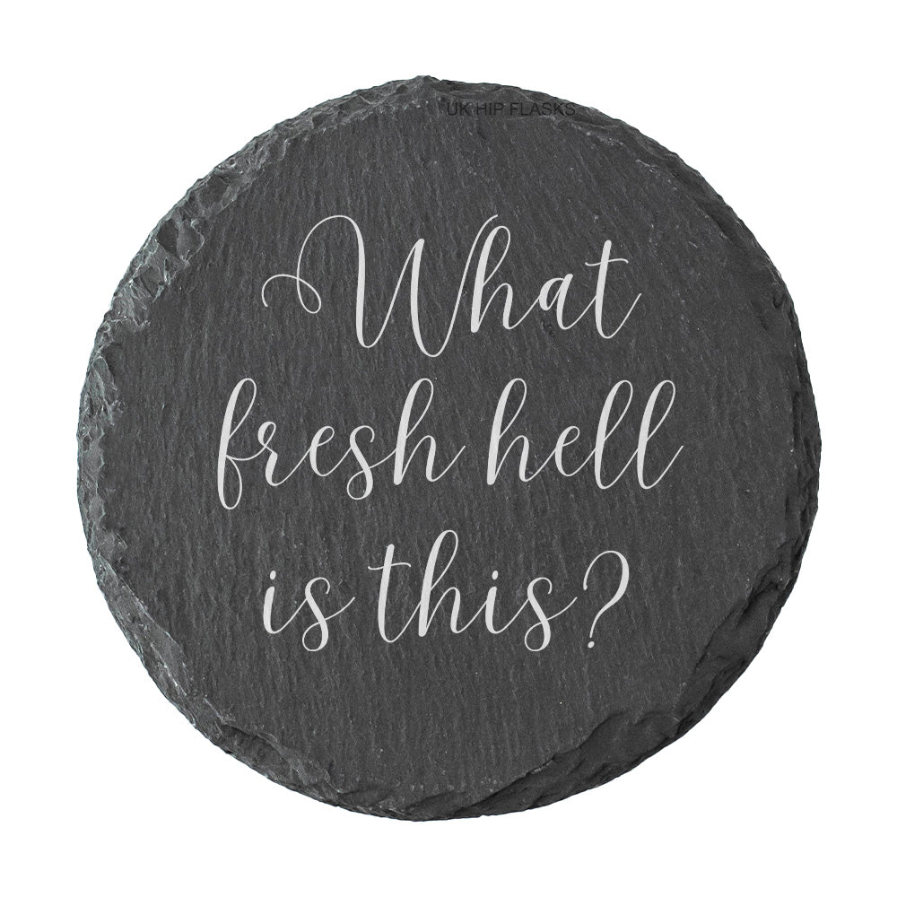 Round slate coaster with "what fresh hell is this?" text on a white background