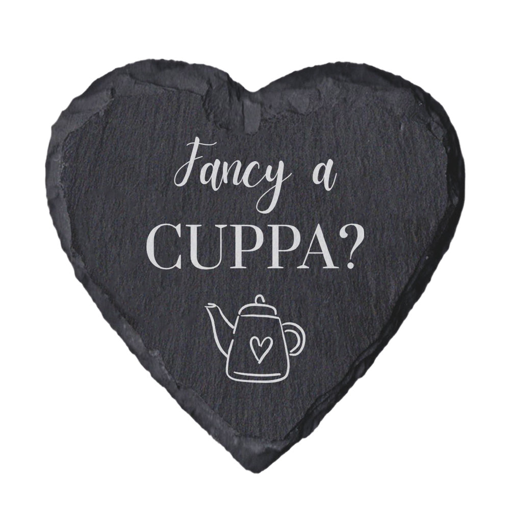 Heart-shaped slate coaster with 'Fancy a Cuppa?' text and teapot illustration on a white background
