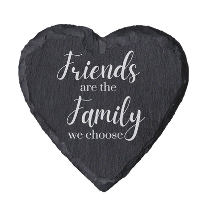 Heart-shaped slate coaster with 'Friends are the family we choose' text on a white background