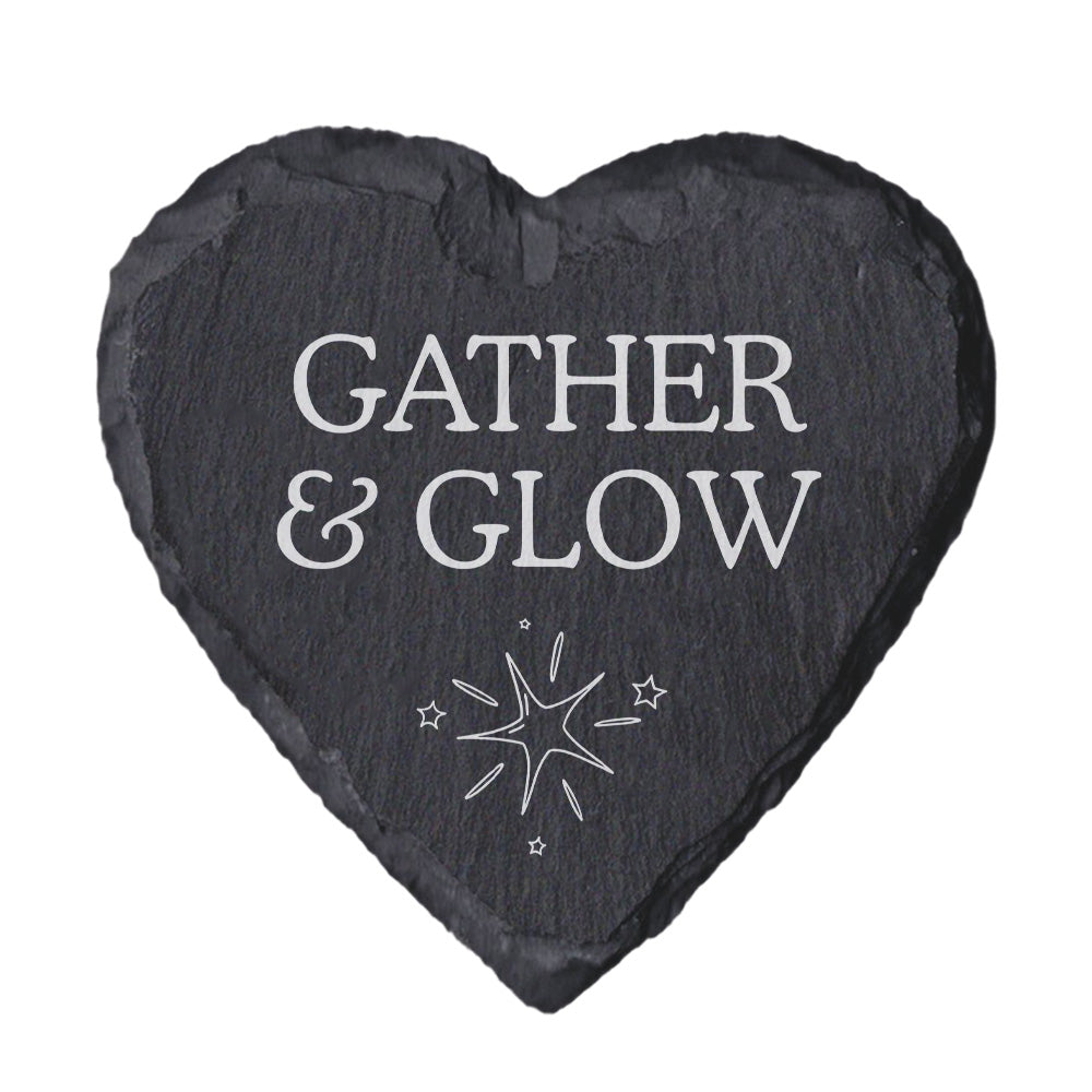Heart-shaped slate coaster with 'Gather & Glow' text and star design on a white background